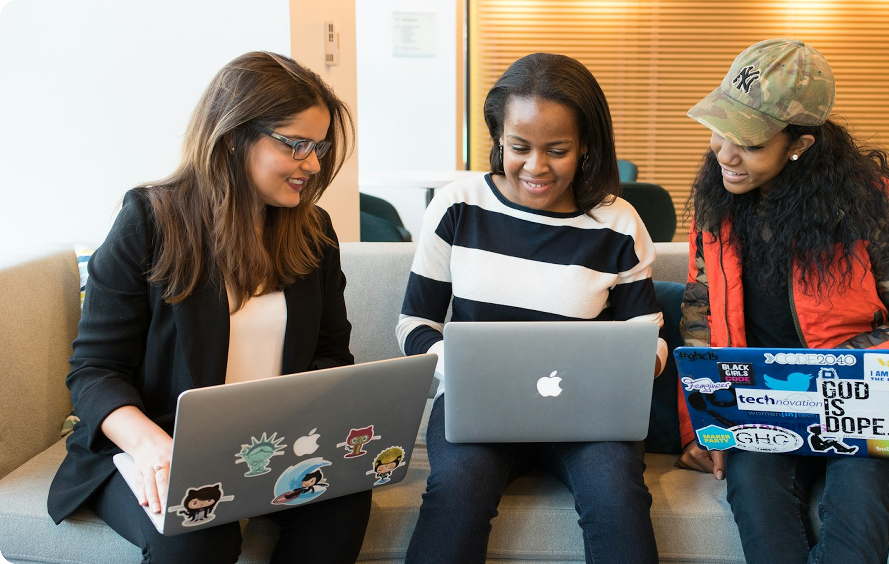 Team collaborating with laptops